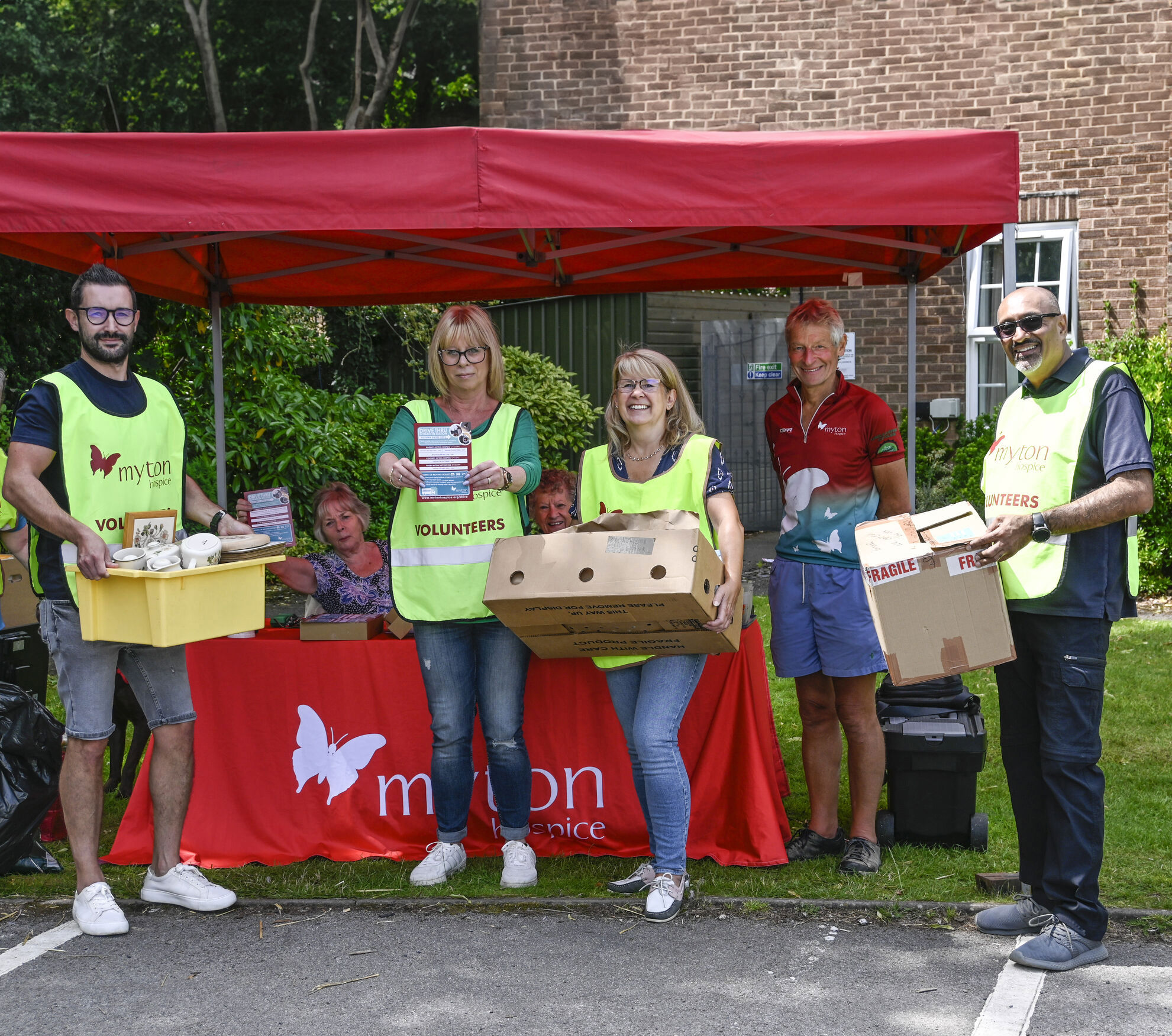 Clear staff members helping out on a Myton Hospice charity stall 